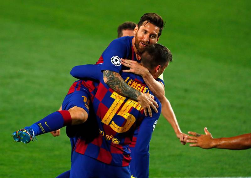 Clement Lenglet is embraced by Lionel Messi after scoring the opening goal. AP