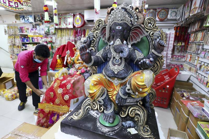 DUBAI, UNITED ARAB EMIRATES , August 17 – 2020 :- Colourful Ganesh statues made by plaster of paris on display at the Madhoor store in Bur Dubai in Dubai. Ganesh Festival will start on 22nd August. Authorities in the UAE are advising the Indian community to limit the number to immediate family members to prevent the spread of the coronavirus. (Pawan Singh / The National) For News/Online/Instagram. Story by Ramola