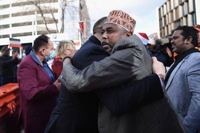 Muslim Association Canterbury President Mohamed Jama celebrates with members of the public outside Christchurch High Court following the sentencing of Brenton Tarrant  in Christchurch, New Zealand. Getty Images