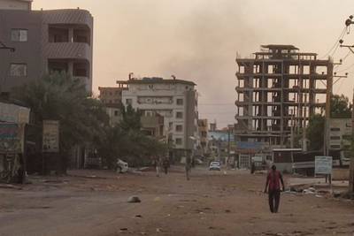 People walk on an almost empty street in southern Khartoum. AFP