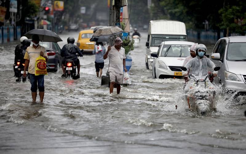 Experts say climate change increases the risk of extreme rainfall, seen here in India. EPA