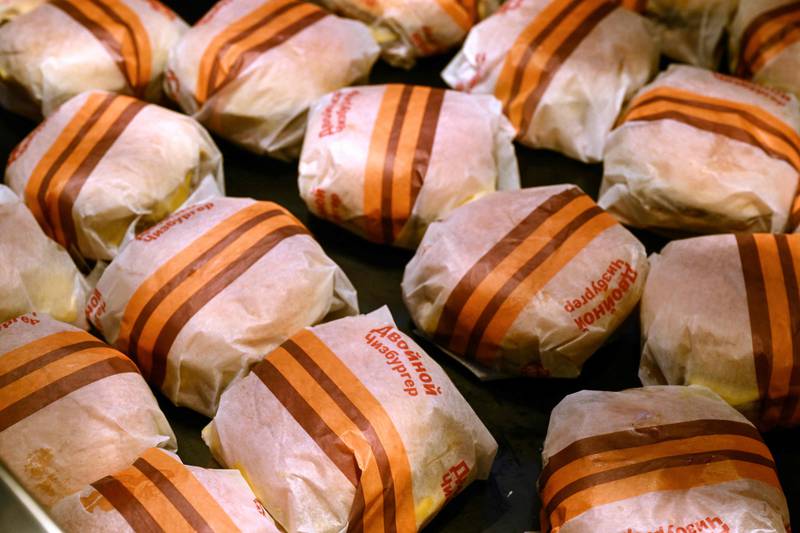 Wrapped double cheeseburgers in the new restaurant. Its opening comes after US fast-food company McDonald's pulled out of Russia in May, after closing all its restaurants in the country in March due to the war in Ukraine. AFP 