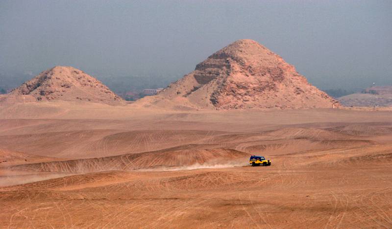 An                          off-road vehicle passes near the 5th Dynasty                          Abusir Pyramids (2464-2323BC) of Dahshur, 30                          kilometres south of Cairo. EPA