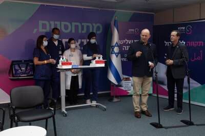 Israeli Prime Minister Naftali Bennett, first right from centre, said a team of expert advisers had agreed it made sense to launch the booster campaign.