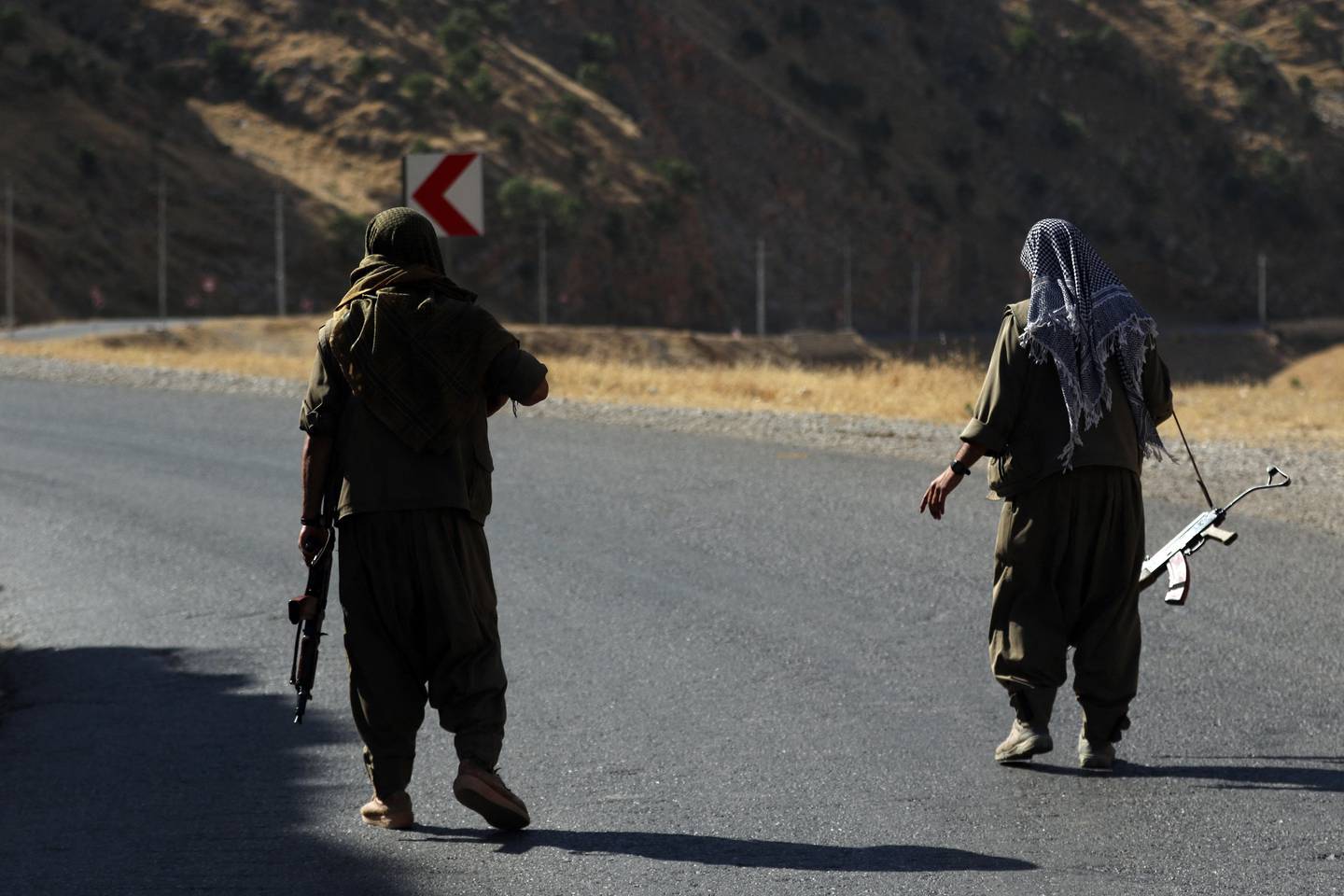 A member of the PKK carries an automatic rifle on a road in the Qandil Mountains, in northern Iraq. AFP