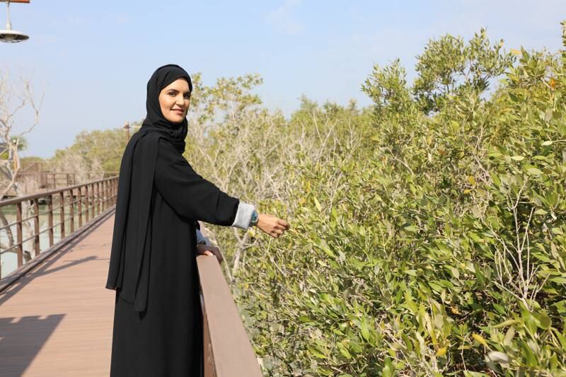 Eng Suaad Al Shamsi planted the first tree as part of the Etihad Mangrove Forest initiative on Jubail Island, Abu Dhabi. Nilanjana Gupta / The National