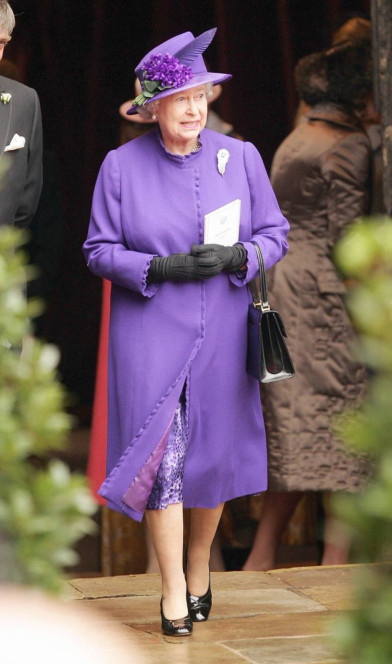 Queen Elizabeth II, wearing purple, leaves Chester Cathedral after the wedding of Lady Tamara Grosvenor on November 6, 2004, in Chester, England. Getty Images