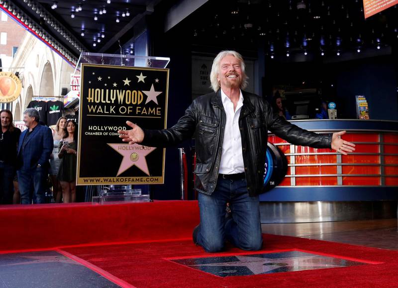Richard Branson poses by his star after it was unveiled on the Hollywood Walk of Fame in Los Angeles, California, U.S., October 16, 2018. REUTERS/Mario Anzuoni     TPX IMAGES OF THE DAY
