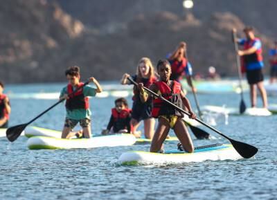 Up to 1,000 people took part in the first Dubai Stand-Up Paddle in Hatta on Saturday. All photos: Victor Besa / The National