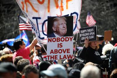 Trump opponents gather as he is arraigned in New York on April 4. Getty / AFP