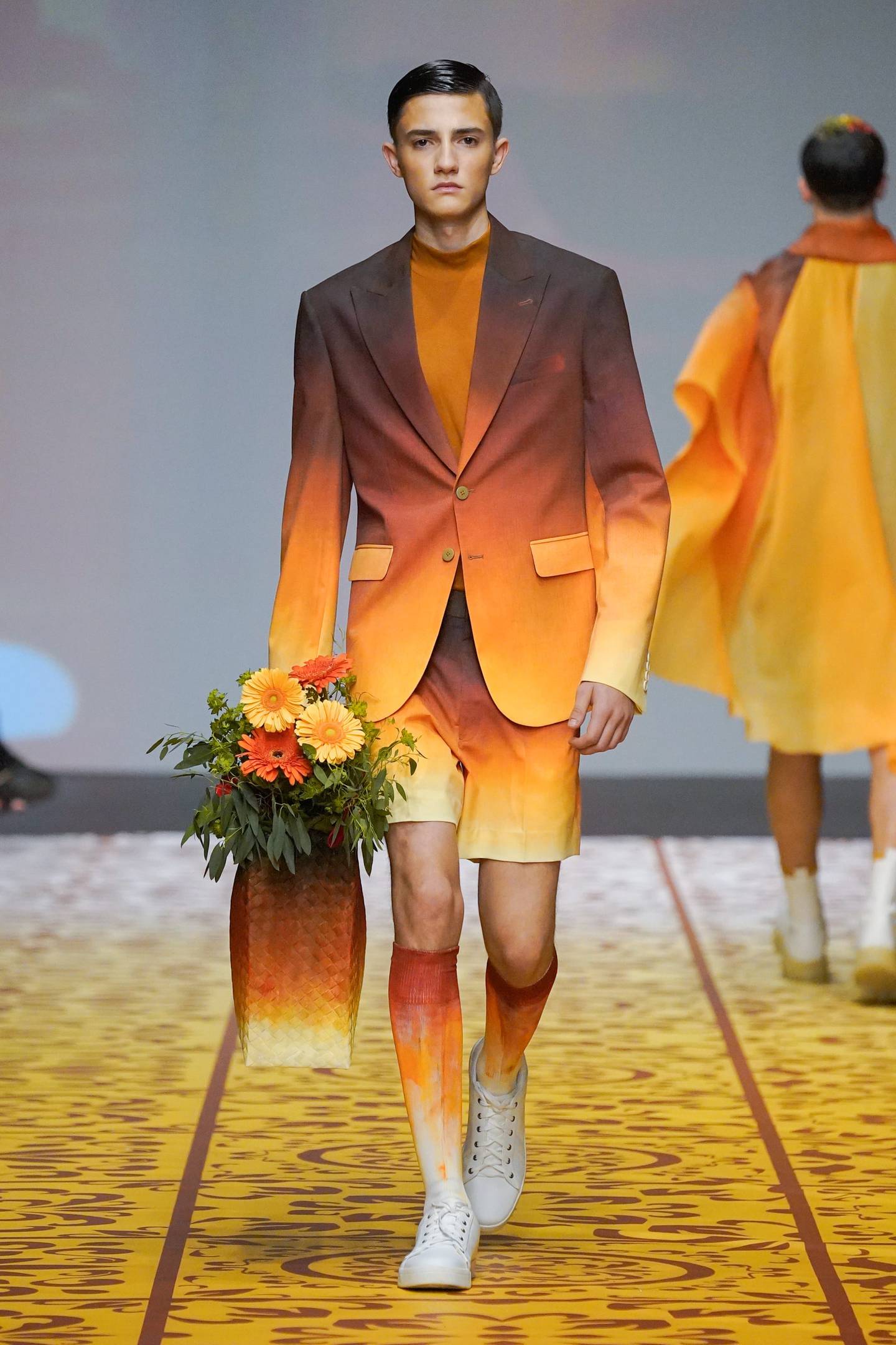 Models carried oversized basket bags filled with flowers. Photo: Michael Cinco
