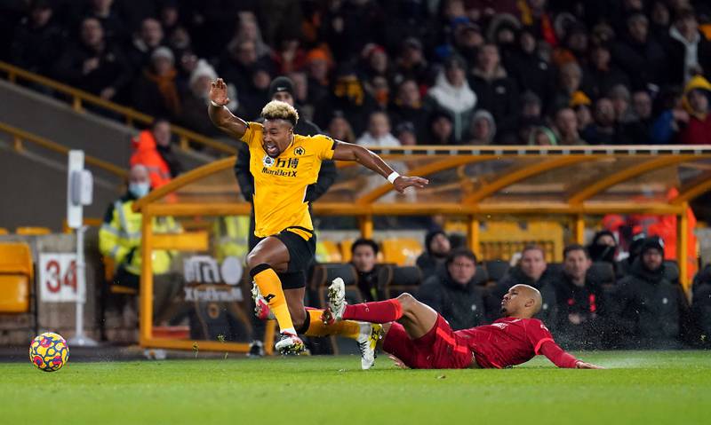 Liverpool midfielder Fabinho fouls Wolves' Adama Traore during the Premier League match at Molineux on December 4, 2021. PA