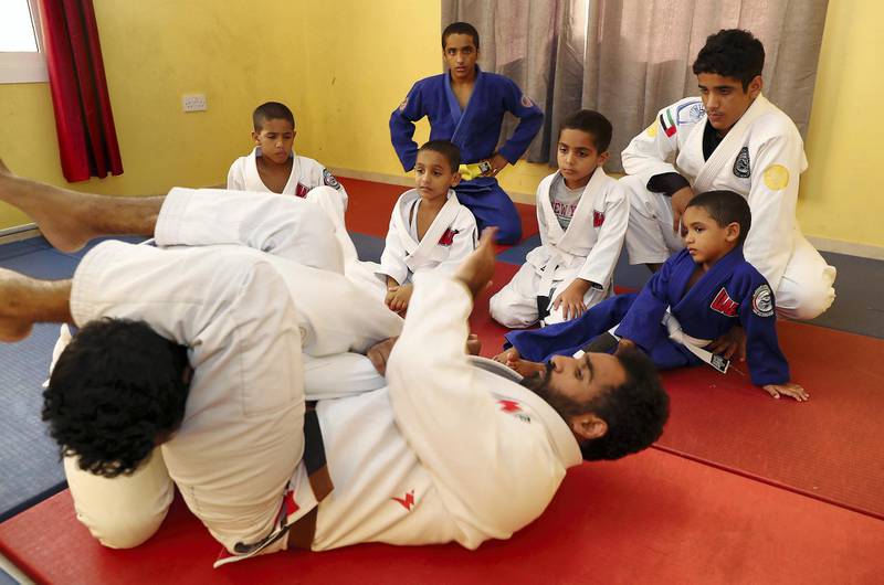 ABU DHABI, UNITED ARAB EMIRATES , April 22– 2020 :- Khaled Al Awlaqi, former Jiu Jitsu player giving training to his seven sons Mahdi (17), Faraj (15), Mohammed (14), Altheeb (8), Mubarak (6), Abdullah (6) and Omar (5) at his home in Baniyas area in Abu Dhabi.  (Pawan Singh / The National) For Sports/Online. Story by Amith
