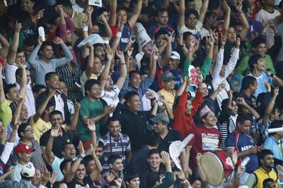 Nepalese supporters match their Afghanistan counterparts even though their cricketers could not at the Sharjah Cricket Stadium. Antonie Robertson /The National