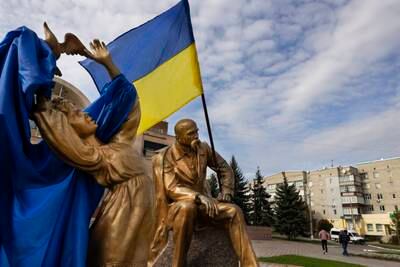 Ukrainian flags in the town square in Balakiya. Getty Images