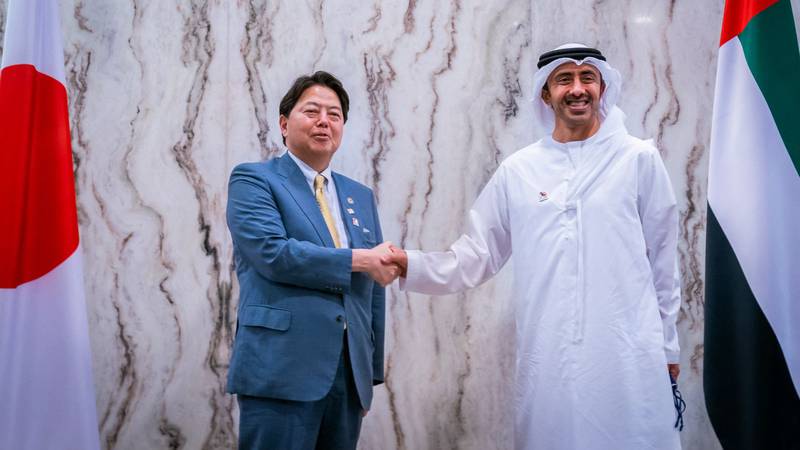 Sheikh Abdullah bin Zayed, Minister of Foreign Affairs and International Co-operation and Yoshimasa Hayashi, Japan's Foreign Minister, in Abu Dhabi on March 21. WAM/ AFP