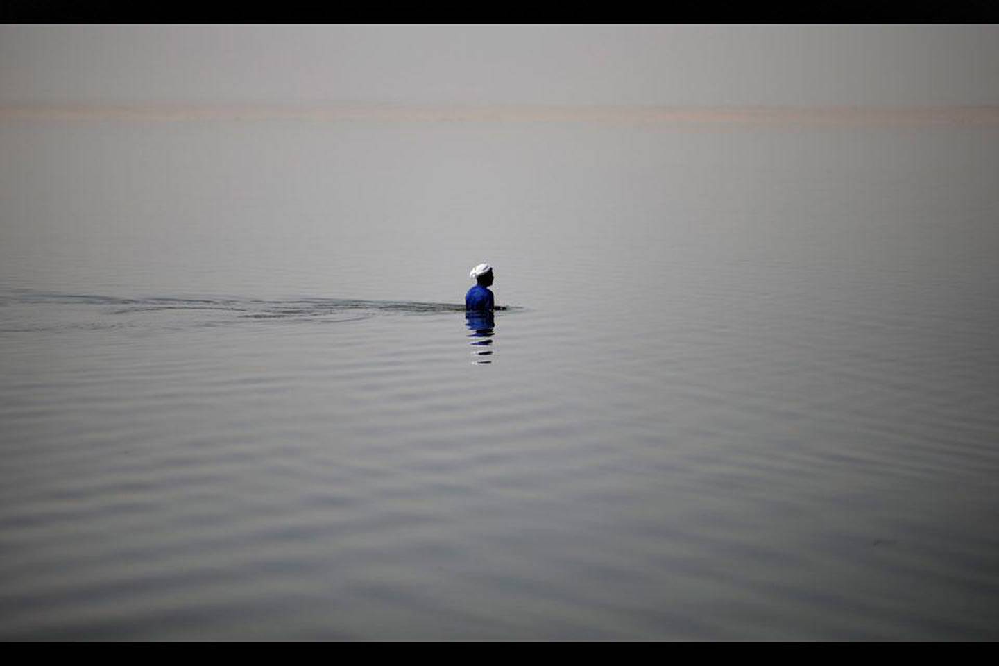 An Egyptian fisherman fishes with a net in Lake Qarun south of Fayoum, Egypt. Hassan Ammar / AP Photo