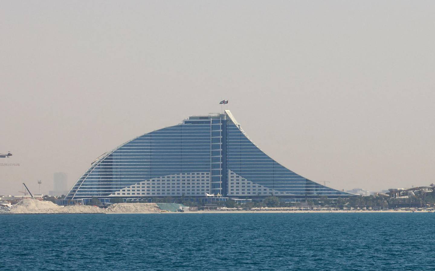 This picture taken on March 3, 2021, shows a view of the Burj Al Arab hotel on the Palm in Dubai in the United Arab Emirates. (Photo by GIUSEPPE CACACE / AFP)