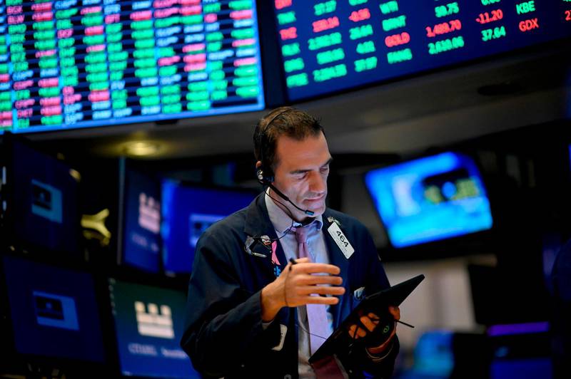 Traders work during the opening bell at the New York Stock Exchange (NYSE) on October 11, 2019, at Wall Street in New York City. Wall Street stocks jumped early Friday on optimism for progress in US-China negotiations, including a possible agreement to pause new tariff measures. The talks in Washington, now in their second day, were given a positive push by US President Donald Trump, who said the negotiations were "going really well" and was scheduled to meet later Friday with China's top trade envoy Liu He. / AFP / Johannes EISELE
