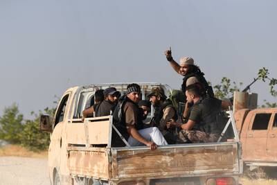 Arab tribal fighters in the Jindires area of Aleppo governorate, heading to the front line with Kurdish YPG militia