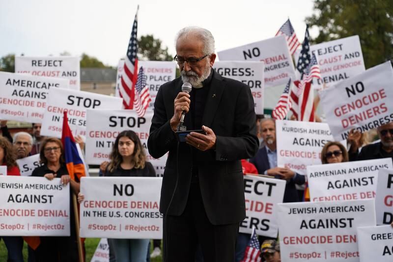 Archpriest Fr Nerses Manoogian of St Gregory's Armenian Apostolic Church opens the protest with a prayer. 