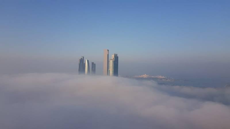 Heavy fog blanketed the UAE capital in December. Photo of Etihad Towers taken from Al Ain Tower in Al Khalidiyah, Abu Dhabi. Erica ElKhershi / The National