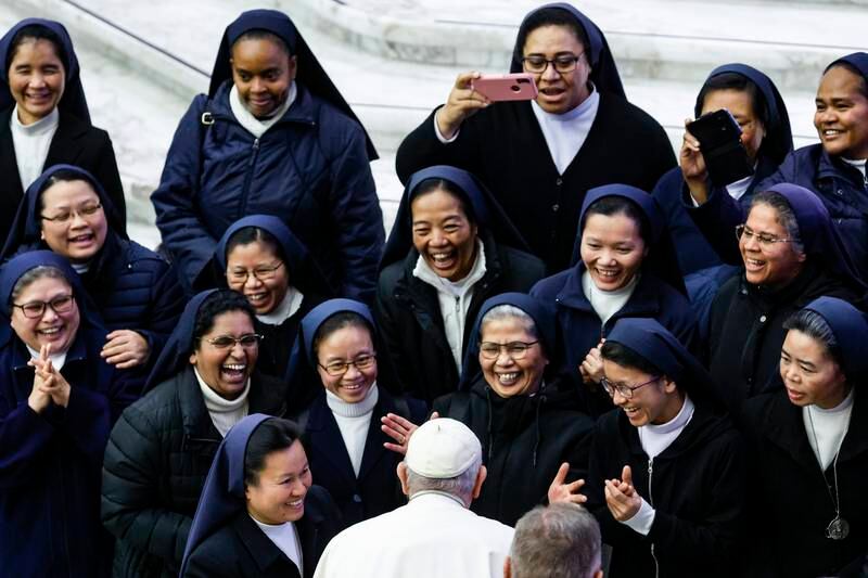 Pope Francis talks with nuns during the weekly General Audience in the Paul VI Audience Hall, in Vatican City. EPA