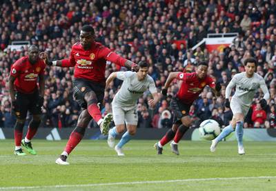 epaselect epa07504058 Manchester United's Paul Pogba (2ndL) shoots to score a penalty during the English Premier League soccer match between Manchester United and West Ham United at the Old Trafford Stadium in Manchester, Britain, 13 April 2019.  EPA/NIGEL RODDIS EDITORIAL USE ONLY. No use with unauthorized audio, video, data, fixture lists, club/league logos or 'live' services. Online in-match use limited to 120 images, no video emulation. No use in betting, games or single club/league/player publications.