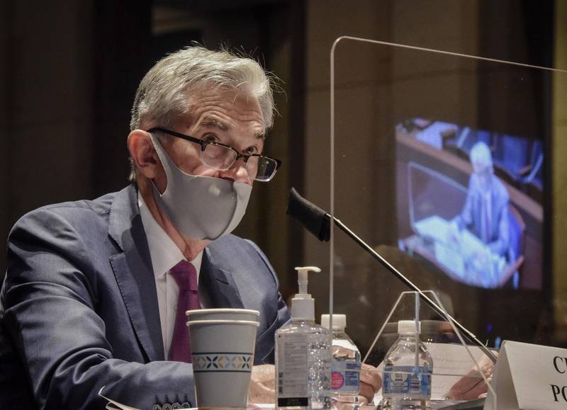 Jerome Powell, Chairman of the US Federal Reserve, sits behind a protective barrier while wearing a protective mask during a House Financial Services Committee hearing in Washington this week. Bloomberg