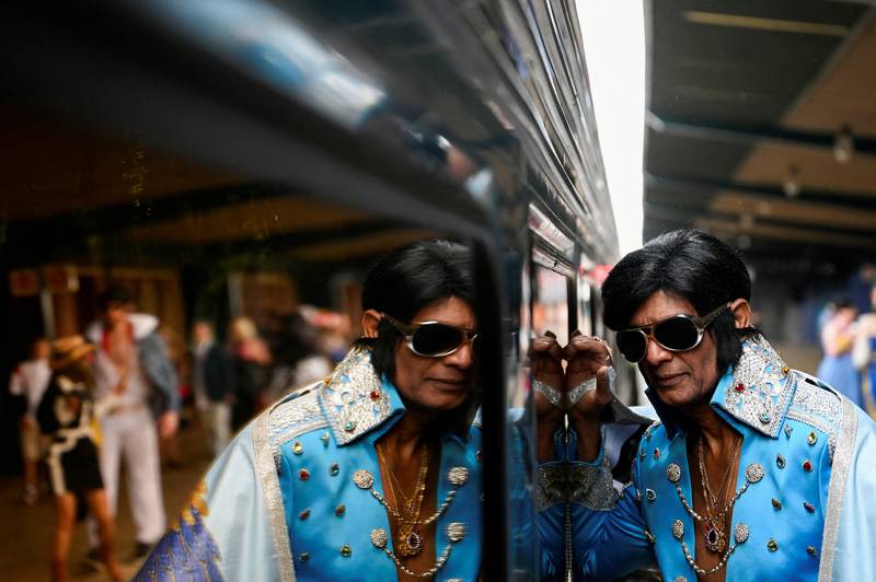 An Elvis Presley impersonator in Sydney waits to take the Elvis Express train to a festival dedicated to the music star in the south-western Australian town of Parkes. Reuters