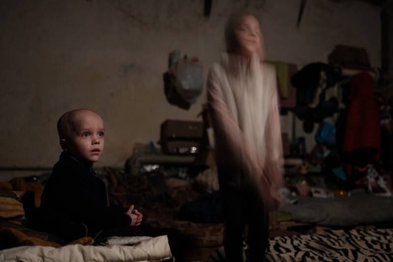 Sasha, left, 4, and his sister Ksenia, 8, in a basement shelter in Lysychansk, eastern Ukraine, on May 15. AFP
