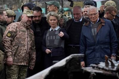 Ms von der Leyen, Mr Borrell and Ukraine's Prime Minister Denys Shmyhal visit the town of Bucha, outside of Kyiv, Ukraine. Reuters