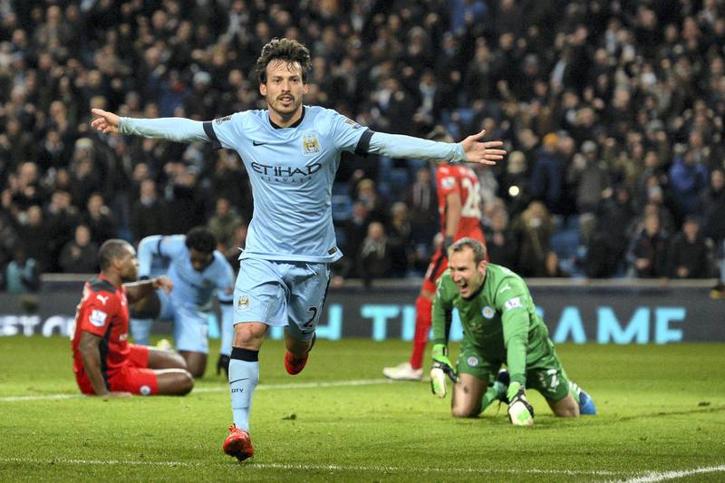 Manchester City's Spanish midfielder David Silva celebrates scoring the opening goal as Leicester City's Australian goalkeeper Mark Schwarzer reacts (R) during the English Premier League football match between Manchester City and Leicester City at the Etihad Stadium in Manchester, north west England, on March 4, 2015. AFP PHOTO / OLI SCARFF

RESTRICTED TO EDITORIAL USE. NO USE WITH UNAUTHORIZED AUDIO, VIDEO, DATA, FIXTURE LISTS, CLUB/LEAGUE LOGOS OR "LIVE" SERVICES. ONLINE IN-MATCH USE LIMITED TO 45 IMAGES, NO VIDEO EMULATION. NO USE IN BETTING, GAMES OR SINGLE CLUB/LEAGUE/PLAYER PUBLICATIONS. (Photo by OLI SCARFF / AFP)