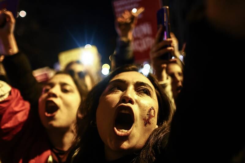 Women shout slogans as they try to march to Taksim Square during a rally. EPA