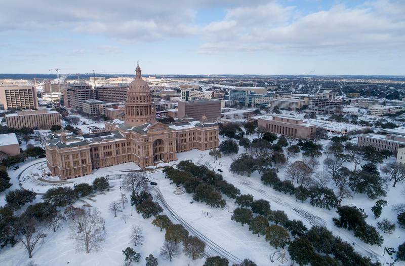 The grounds of the Capitol in Austin, Texas, are covered in snow. AP