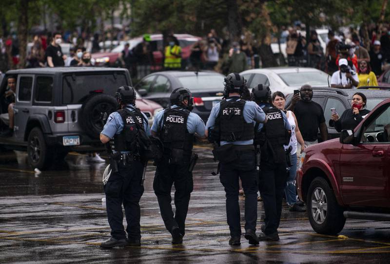 Police dressed in tactical gear attempt to disperse crowds gathered to protest the death of George Floyd outside the 3rd Precinct Police Station in Minneapolis, Minnesota. AFP
