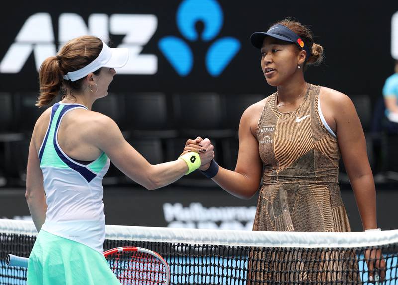 Naomi Osaka and Alize Cornet greet each other at the net after their match. Reuters