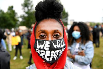 A demonstrator wearing a protective mask attends a Black Lives Matter protest  in Amsterdam, Netherlands. REUTERS