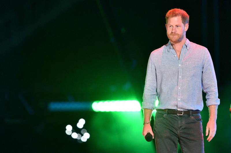 (FILES) In this file photo taken on May 02, 2021 Co-Chair Britain's Prince Harry, Duke of Sussex, arrives onstage to speak during the taping of the "Vax Live" fundraising concert at SoFi Stadium in Inglewood, California. In a new documentary series set for release May 21, 2021 Prince Harry is once again emphasizing that his family turned a blind eye to the struggles of his wife Meghan Markle, saying he will "never be bullied into silence." / AFP / VALERIE MACON                       
