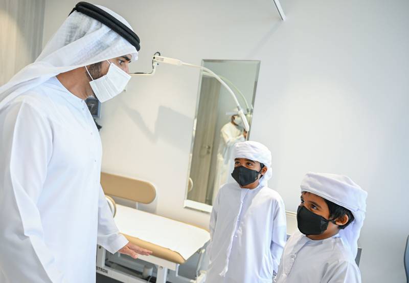 Sheikh Hamdan meets children at the opening of the new outpatient building.