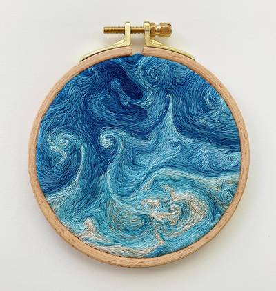 Cascading swirls in myriad shades of blue, green and the occasional brown characterise Danielle Currie’s embroidery art. Photo: Danielle Currie