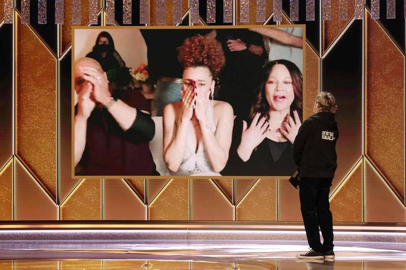 Andra Day reacting after being named winner of the Best Actress - Motion Picture Drama award for 'The United States vs Billie Holiday' via video from Joaquin Phoenix at the 78th Annual Golden Globe Awards. AFP / NBCUniversal