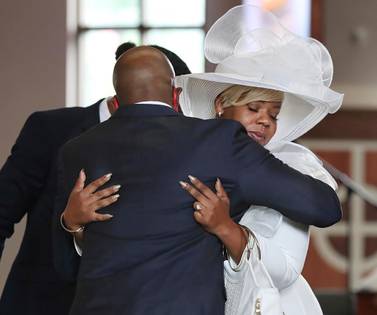 A church pastor comforts Tomika Miller, the wife of Rayshard Brooks, during his public viewing in Atlanta. Atlanta Journal-Constitution via AP