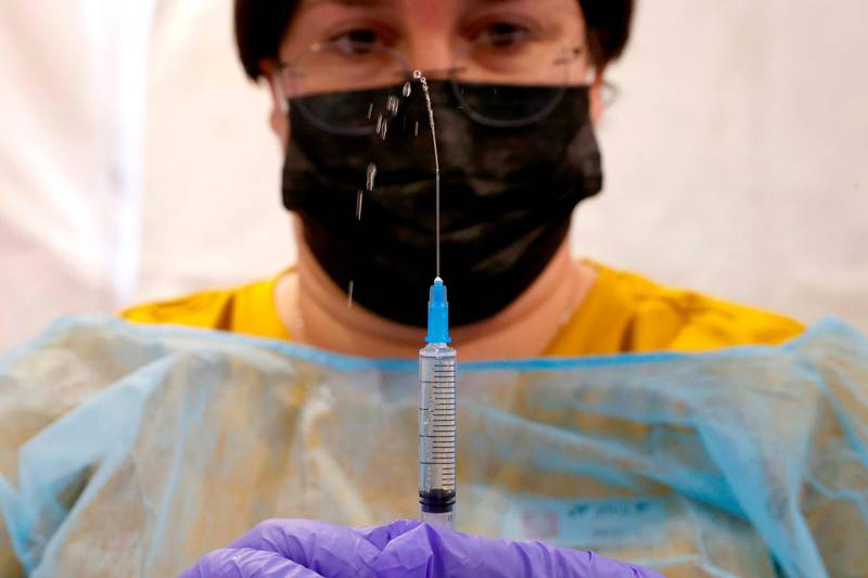 A healthcare worker prepares a dose of the Pfizer-BioNtech Covid-19 vaccine at a large vaccination centre open by the Tel Aviv-Yafo Municipality and Tel Aviv Sourasky Medical Center. AFP