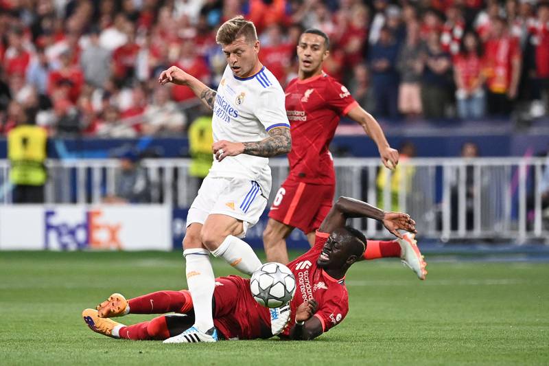 Real Madrid's German midfielder Toni Kroos battles with Liverpool striker Sadio Mane in the Champions League final. AFP