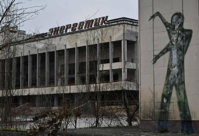 Graffiti on a building wall on the central square of the ghost town of Pripyat, not far from Chernobyl nuclear power plant.  AFP