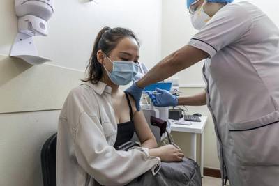 Covid-19 inoculations start in Dubai for Chinese nationals on visit visas to the UAE at the Al Safa Health Centre in Dubai on May 27th, 2021. Xia Zining get her vacination shot.Antonie Robertson / The National.Reporter: Ramola Talwar for National.