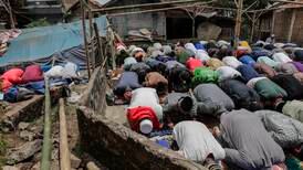 Indonesians pray outdoors as earthquake death toll rises to 310
