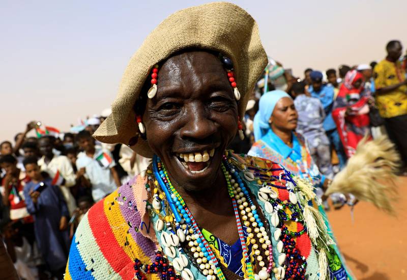 A supporter of Lieutenant General Mohamed Hamdan Dagalo, deputy head of the military council and head of paramilitary Rapid Support Forces (RSF), dances during a meeting in Aprag village, 60km away from Khartoum, Sudan. Reuters