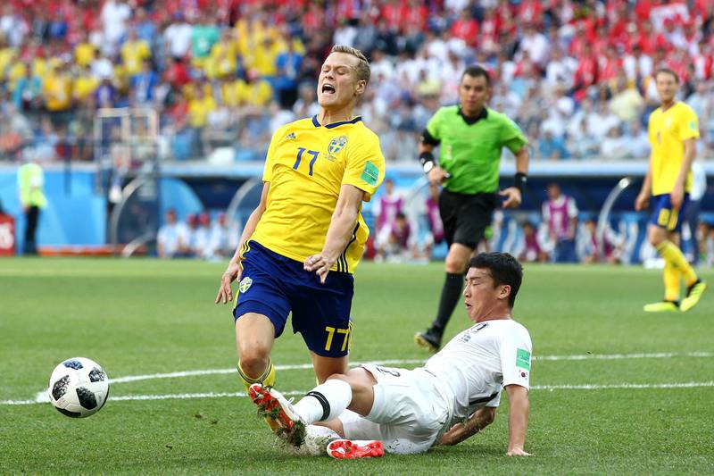 Kim Min-Woo fouls Viktor Claesson to award Sweden a VAR-led penalty. Jan Kruger / Getty Images
